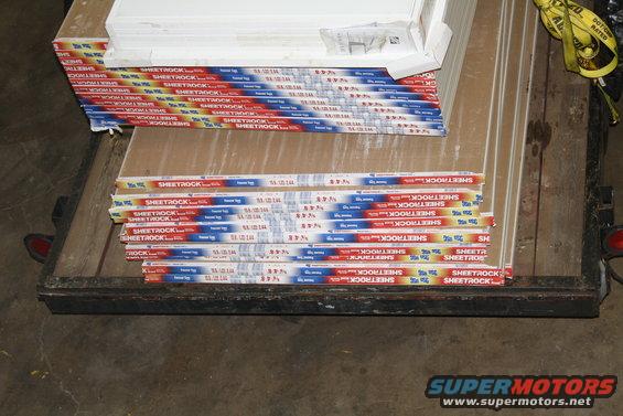 Stack of Sheetrock panels on a trailer bed