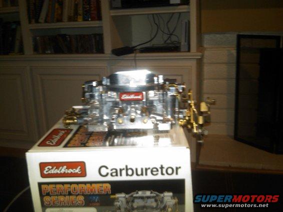 Chrome Edelbrock carburetor on a box labeled "Carburetor Performer Series"