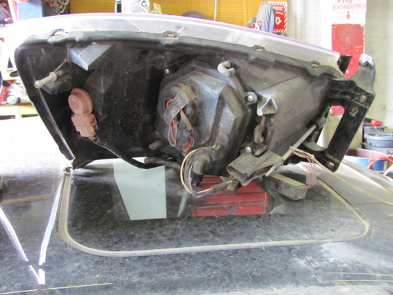 Headlight assembly with wiring harness and mounting bracket