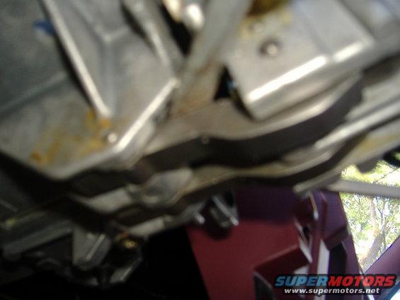 Close-up of metal steering column parts, some showing rust