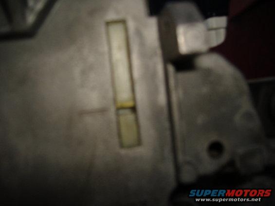 Close-up of a metal part with a rectangular window