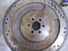 1990 Ford Mustang - Rusty flywheel with part number E6TR-BA visible, likely for an older vehicle.