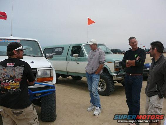 Two-tone Ford pickup truck with camper shell, 3q-front view
