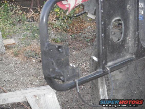 Black metal bumper attached to a tire on a vehicle