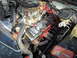 1988 Chevrolet Monte Carlo - Close-up view of a V8 engine, likely from a classic car, with aftermarket parts visible.