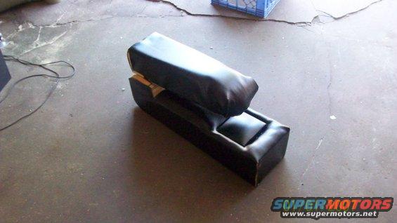 Black vinyl center console with storage compartment
