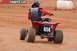 2004 Honda TRX 400 EX - A rider on a red ATV with the number 414 navigates a dirt track.