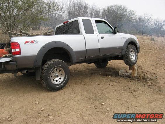 Silver and grey pickup truck with FX4 badging, side view, off-road tires