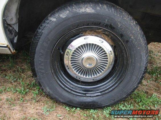 Chrome Ford hubcap on a black wheel, 1971