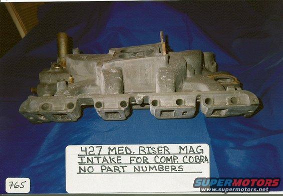 Aluminum intake manifold labeled '427 MED. RISER MAG INTAKE FOR COMP. COBRA NO PART NUMBERS'