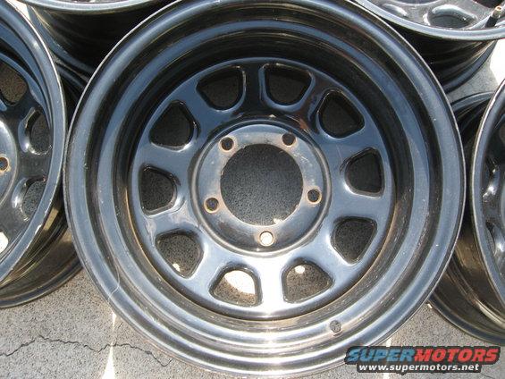 Several black steel wheels stacked together