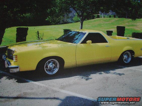 Yellow 1979 Ford Ranchero parked on asphalt, side view