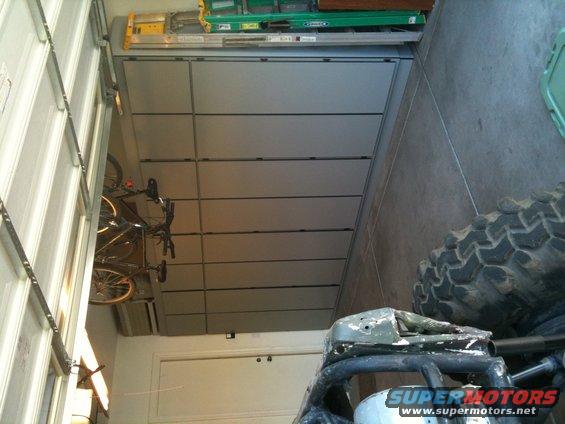 Garage interior with a tire, bicycle, and garage door