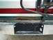 1989 Ford Bronco - The rear bumper and license plate area of a vehicle are visible, with significant rust on the body panel.