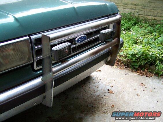 Green 1989 Ford Bronco front end with chrome bumper and grille