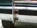1989 Ford Bronco - Detail shot of a vehicle's front end, focusing on the bumper and brush guard assembly.