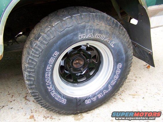 Wheel and tire with "WORKHORSE" and "GOOD YEAR RADIAL" text