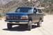 1995 Ford Bronco - This 1995 Ford Bronco is shown from a 3/4 front view on a dusty, off-road path.