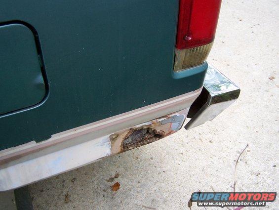 Rear bumper corner of a 1989 Ford Bronco with rust damage
