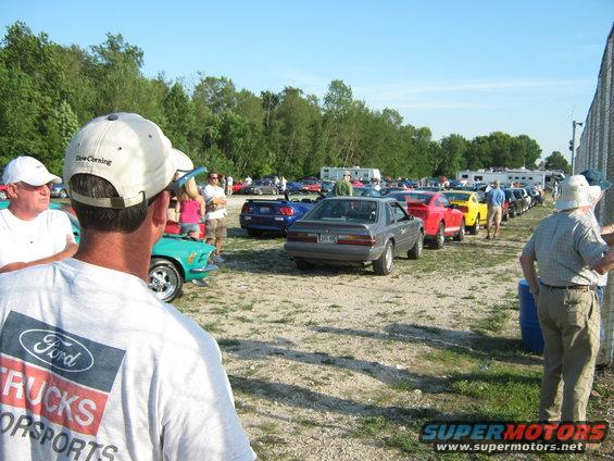 Gray 1985 Ford Mustang parked in a line with other cars