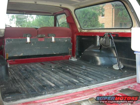 1979 Ford Bronco interior cargo area with red seats and black floor