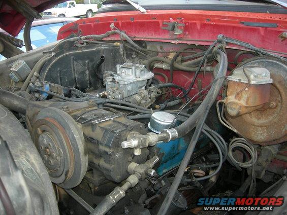Engine bay with carburetor and visible engine components