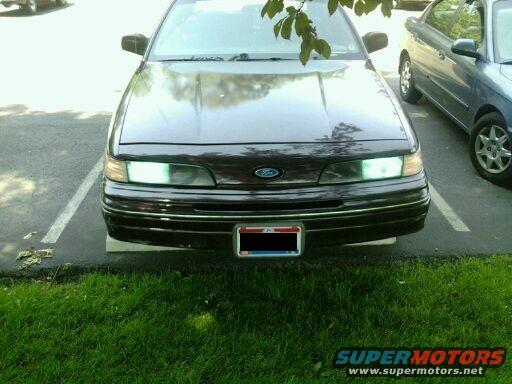 1992 Ford Crown Victoria front end parked in a lot, another car to the right