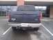 2005 Ford F-250 - Rear view of a dark blue 2005 Ford F-250 pickup truck parked in a lot.