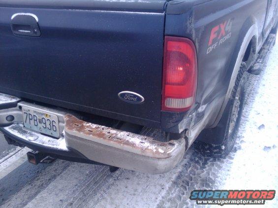 Rear of a dark blue 2005 Ford F-250 Super Duty with FX4 Off Road badging. License plate is 7PB 936