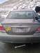 2005 Ford F-250 - Rear view of a gray Toyota Camry, a yellow awareness ribbon sticker and a license plate.