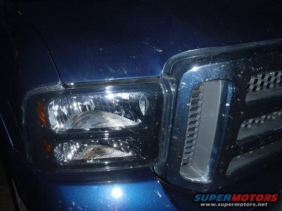 Blue 2005 Ford F-250 grille and headlight assembly, front view