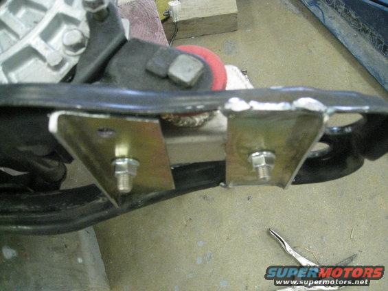 Engine mount bracket with custom metal plates and bolts