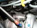 2004 Mercury Marauder - Close-up view of a turbocharger assembly, including the exhaust manifold and braided oil feed line.