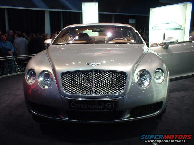 Silver Bentley Continental GT front view, grille and headlights visible