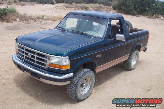 1995 Ford Bronco parked on dirt road