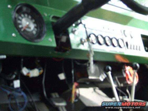 1976 Ford Bronco interior dashboard with gauges and shifters