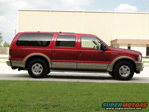 Red Ford Excursion side view