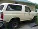 1985 Ford Bronco - This is a side view of a Ford Bronco, likely from the early 1980s, parked in a residential area.