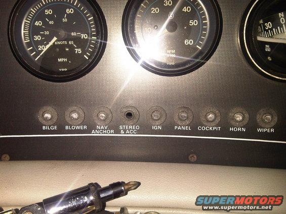 Boat dashboard with VDO gauges and labeled switches for Bilge, Blower, Nav Anchor, Stereo & Acc, Ign, Panel, Cockpit, Horn, Wiper