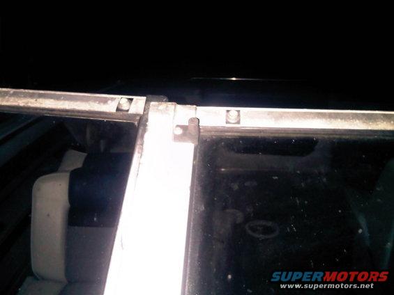 Close-up of boat interior with seats and window frame visible. Supermotors.net logo in corner