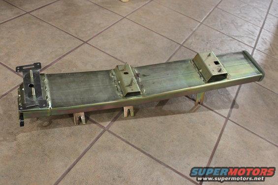 6w7z-18c420-aa metal bracket (where the shifter mounts) also acts as part of the rear a/c duct work.