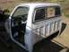 1979 Chevrolet C/K Pickup - This is a 1973 Chevrolet C/K Pickup truck cab, seen from the side with its doors open.