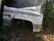 1979 Chevrolet C/K Pickup - This white truck fender, identified as Custom Deluxe, features a distinctive stripe decal and matches the 1979 Chevrolet C/K Pickup.