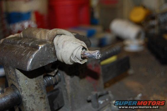 4 gauge Welding cable. A damp cloth is wrapped around the insulation while tinning and soldering to prevent burning.