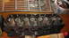 1964 Ford Fairlane - Close-up of a Ford V8 engine cylinder head with valve springs and a chrome grille piece.