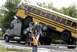 1972 Ford Ranchero - A severe accident scene shows a school bus atop a semi-truck, with a car trapped beneath the wreckage.