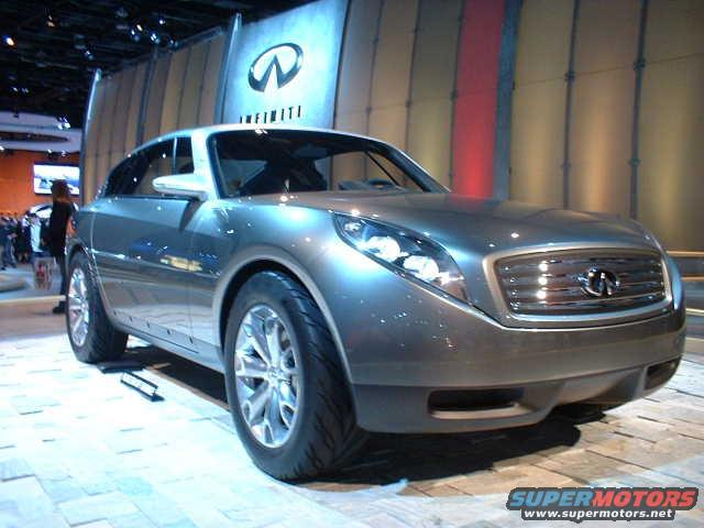 Infiniti concept SUV on display with Infiniti logo in background