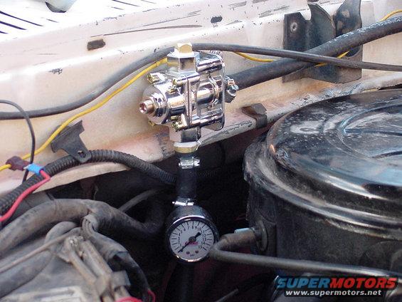 pressure-regulator-and-gauge.jpg Holley fuel pressure regulator and Summit Racing pressure gauge. Usually run at 5-1/2 psi with carb. Used to run at 14psi with TBI fuel injection.
