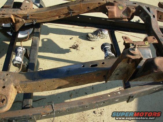 frame13eb.jpg SOLD Apr22 The VIN stamping is in the clean spot where the R shock tower's shadow crosses the near frame rail.

I've started cleaning it so I can take some measurements. I'm also removing all the junk parts & welded-on crap.