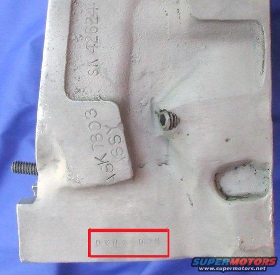 Metal part with casting numbers ASK 7803 ASSY and SA 42624, and DYNC 90M stamped